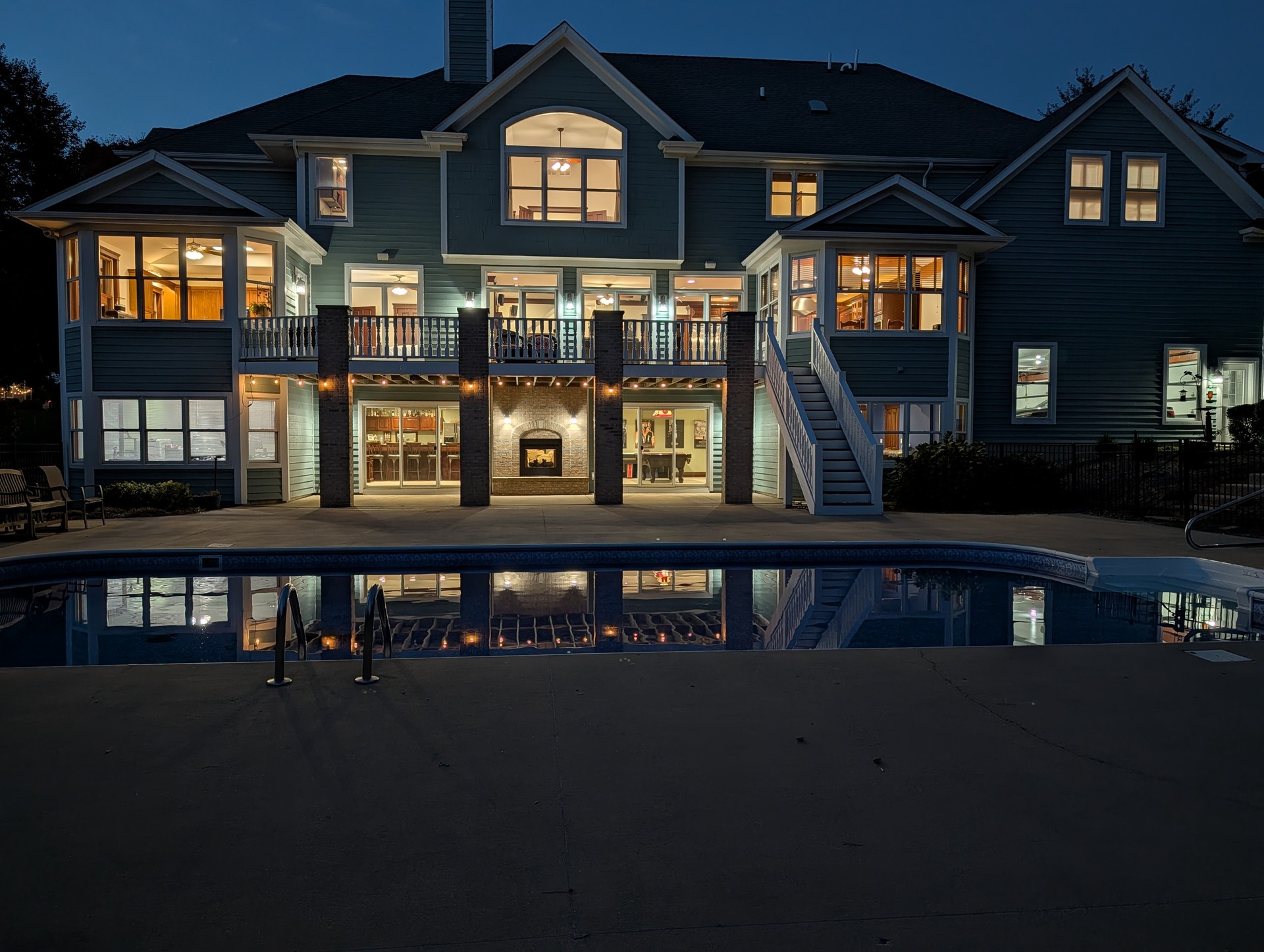 Back of house and pool at dusk